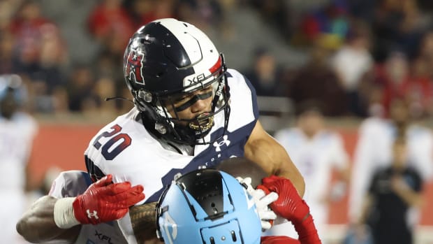 Feb 26, 2023; Houston, TX, USA; Houston Roughnecks running back Dejourn Lee (20 ) rushes against Arlington Renegades defensive back Jamal Carter (22) in the fourth quarter at TDECU Stadium. Mandatory Credit: Thomas Shea-USA TODAY Sports  